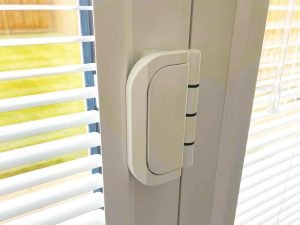 Close up of bi-fold door hinge. Pros and cons of bi-fold door blinds.