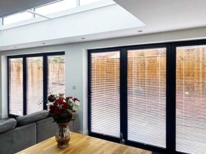 Bifold doors with window shutter blinds.