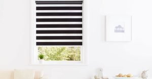Black and white, day and night home office blinds in a modern lounge.
