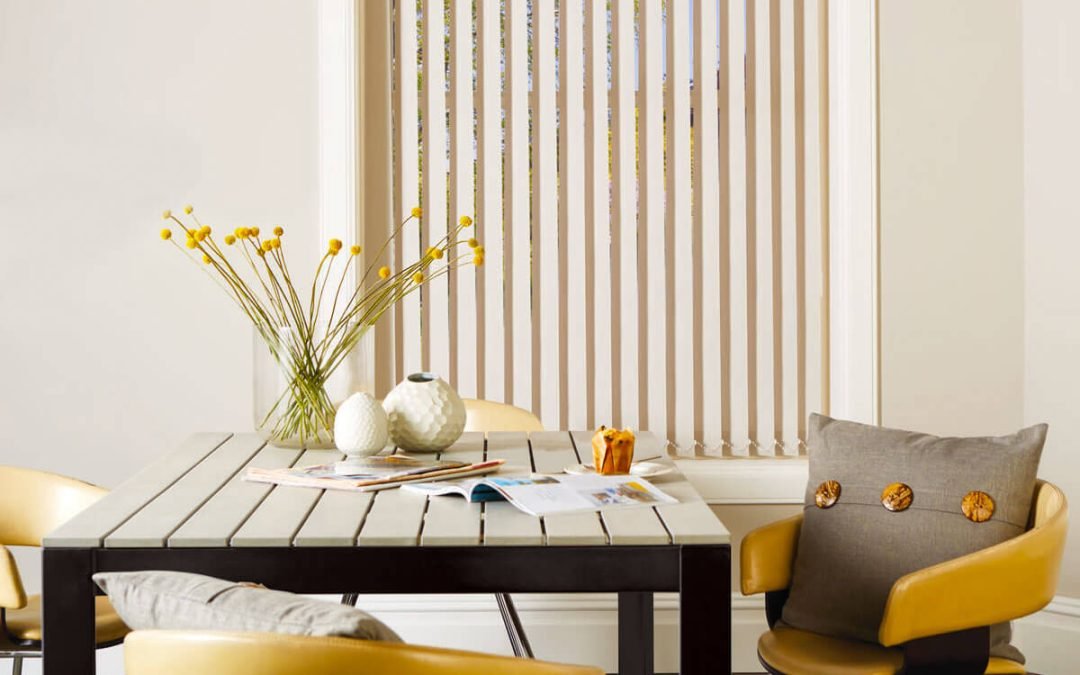 Colourful home office blinds with modern, wooden table and chairs.