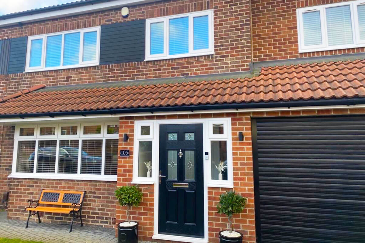 White venetian blinds in windows of modern new build house.