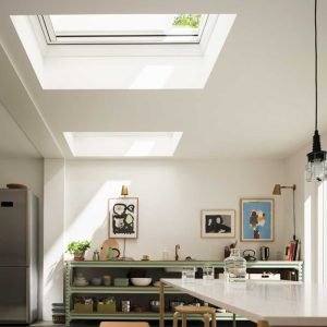 Skylight blinds in modern, white and green kitchen area.